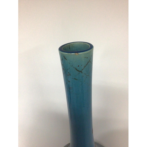 943 - A Japanese late 19th century large blue glazed bottle vase. Height 50cm