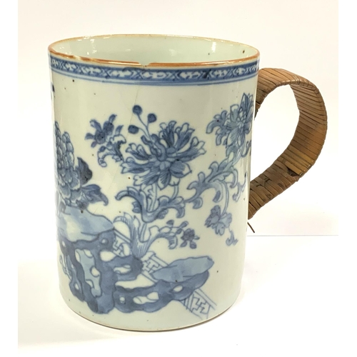 966 - An 18th Century Chinese export blue and white porcelain mug with replacement wicker handle 12cm toge... 