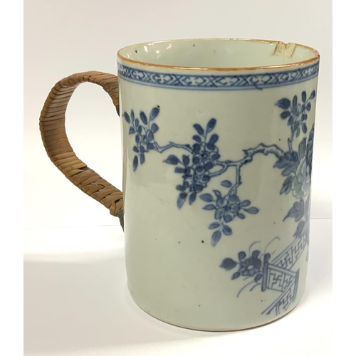 966 - An 18th Century Chinese export blue and white porcelain mug with replacement wicker handle 12cm toge... 