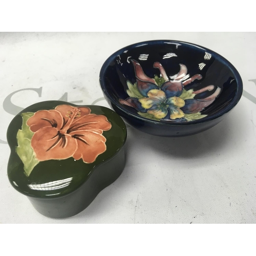 1003 - A Moorcroft pin dish together with a thicket box and cover.