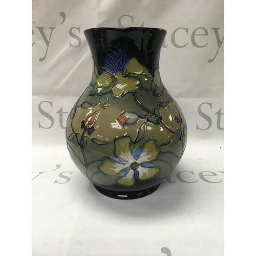 1010 - A Moorcroft Hyericum Rachel Bishop vase 25 cm .