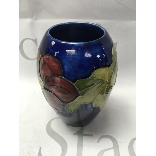 1017 - A Moorcroft vase decorated with Anenone Flowers 12 cm .no damage or restoration.