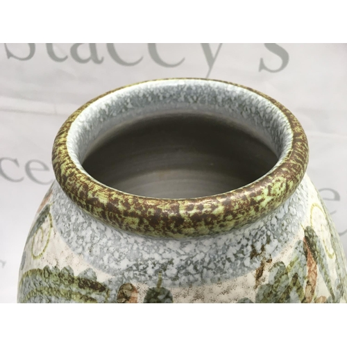 1023 - A Denby pottery studio vase, decorated in tones of green, browns, grey , 31.5cm tall approximately .... 