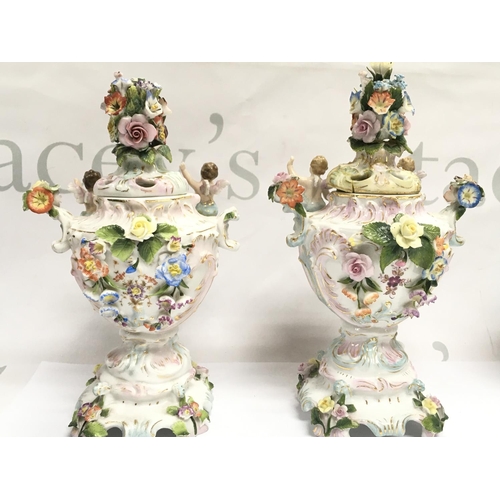 1026 - A pair of Chelsea porcelain Potpourri vases , some damage . 21cm tall approximately. This lot cannot... 