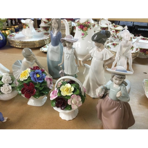 1086 - A collection of assorted ceramic figurines including NAO royal Doulton etc.