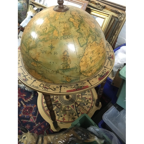 1337 - A vintage globe bar with glasses , approximately 90cm tall