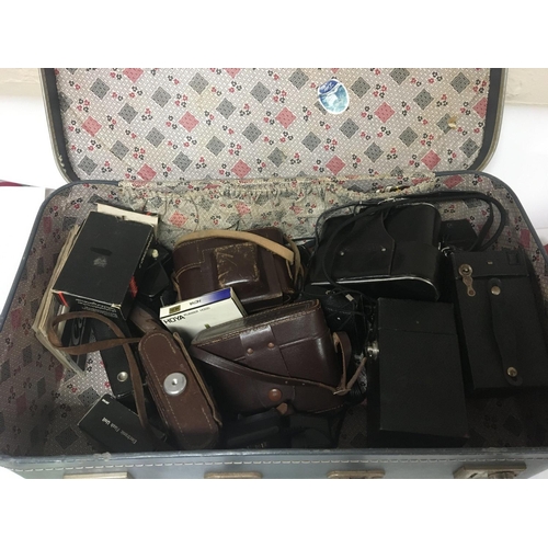 2308 - A case containing vintage camera equipment