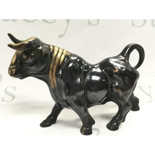 757 - Bronze Bull and Rhino figures , 10 & 14cm tall. Postage category B