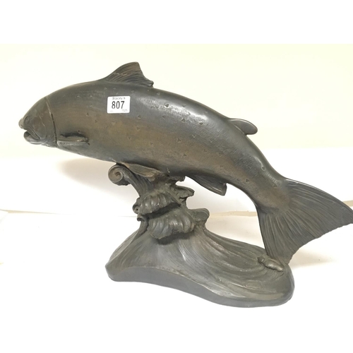 807 - A large cold cast bronze of a leaping wild Salmon on a scrolling wave. Signed by B Elton length 64cm... 