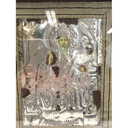 810 - A framed Russian icon on wood, silver background. This lot cannot be posted