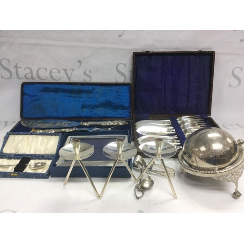 814 - A box of silver plated items comprising a Danish modern design three branch candelabra, three entree... 