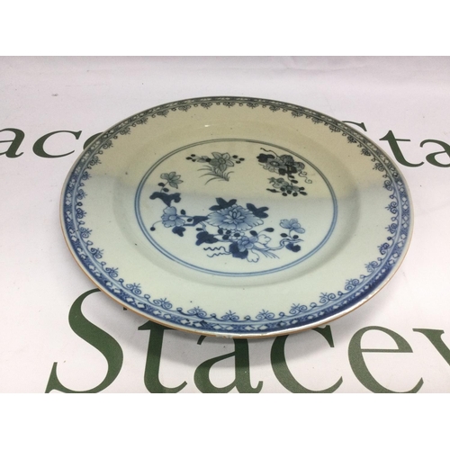 870 - A Chinese blue and white dish decorated with floral sprays, approx diameter 23cm. Shipping category ... 