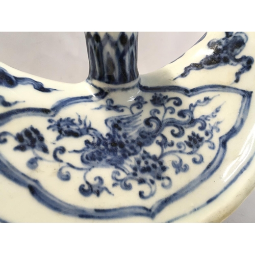 920 - A Chinese Islamic blue and white porcelain four footed candle holder, hand painted crescent shaped p... 