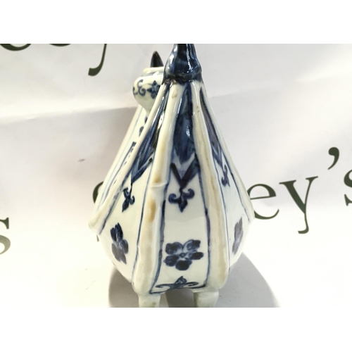 920 - A Chinese Islamic blue and white porcelain four footed candle holder, hand painted crescent shaped p... 