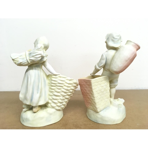 987 - German classical style porcelain figures, boy and girl with baskets. This lot cannot be posted