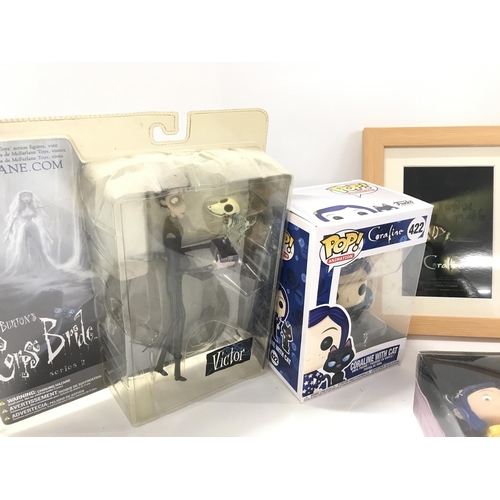 100 - A Collection of Boxed Coraline Figures. A Coraline Framed Film Cell. A Monster High Frankie Stein Do... 