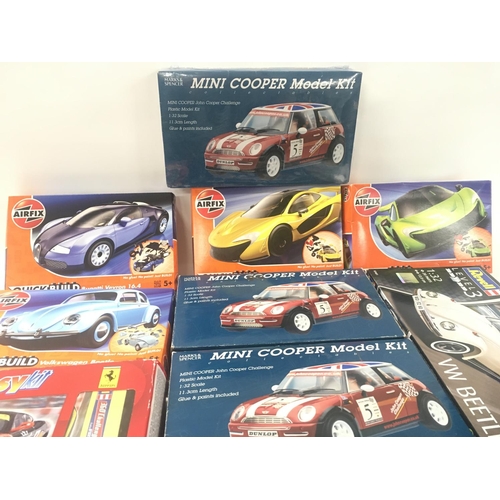 102 - A collection of 12 boxed model car kits by Airfix..Revell and Marks and Spencerâs.