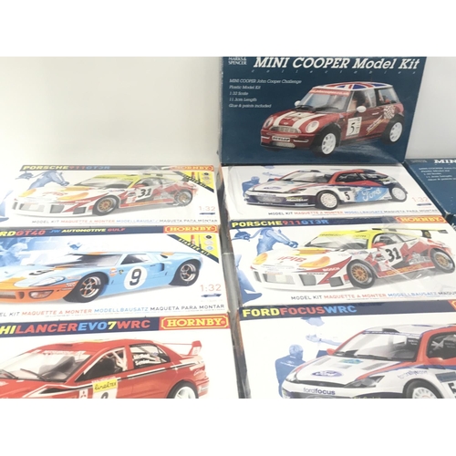 103 - A collection in excess of 12 model car kits by Hornby and Marks and Spencerâs