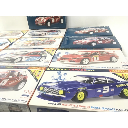 103 - A collection in excess of 12 model car kits by Hornby and Marks and Spencerâs