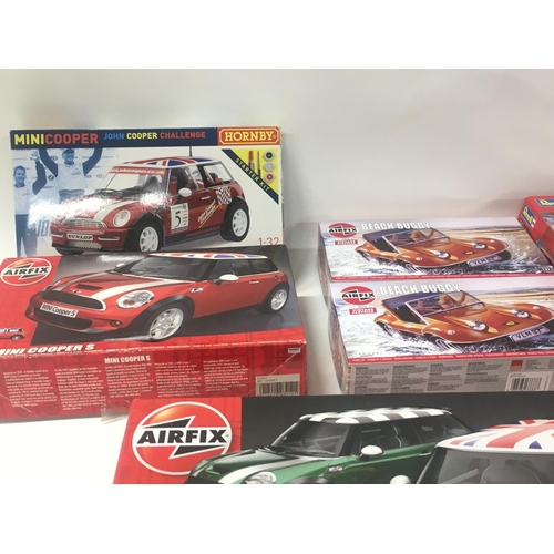 105 - A collection of 7 model car kits by Airfix ..Hornby and Revell