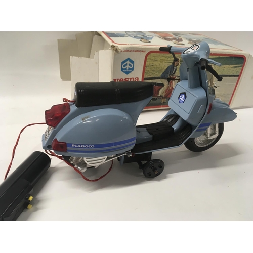 130 - A boxed Piaggio Vespa scooter battery operated. Box in poor condition.