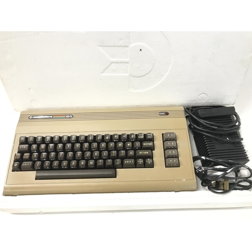 139 - A Boxed Commodore 64 With Disk Drive.2 Boxes Of Games and A Philips Monitor etc . No Reserve. (5).