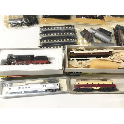 147 - A Collection of 4 N Gauge Locomotives and A Collection of Rolling Stock. No Reserve.