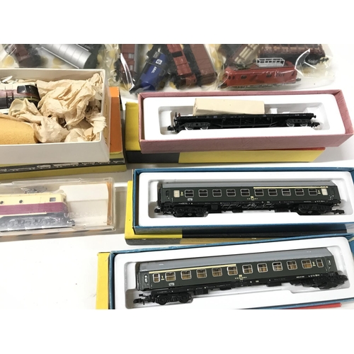 147 - A Collection of 4 N Gauge Locomotives and A Collection of Rolling Stock. No Reserve.