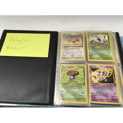 164 - A collection of 5 albums containing PokÃ©mon cards . album 1 contains Jungle Rocket.. album 2 contai... 