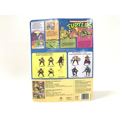 219 - A Carded Playmates Teenage Mutant Hero Turtles Donatello Figure. Blister has Some Damage. Un punched... 