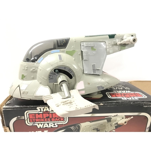 221 - A Boxed Vintage Star Wars Slave 1. Box is worn And Parts Missing. No Reserve.