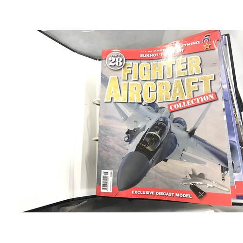 228 - A Box Containing Fighter Aircraft Models and A Binder Of Magazines.