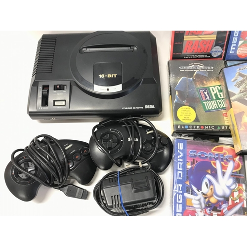 233 - A Sega Mega Drive and A Collection of Games. No Reserve.