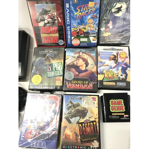 233 - A Sega Mega Drive and A Collection of Games. No Reserve.