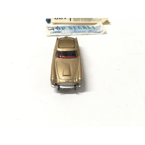 24 - A boxed 261 Corgi James Bond 007 gold coloured Aston Martin DB5. Includes 2x ejector passengers and ... 