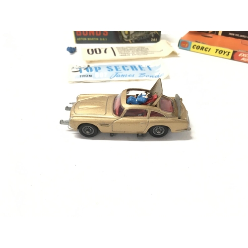 24 - A boxed 261 Corgi James Bond 007 gold coloured Aston Martin DB5. Includes 2x ejector passengers and ... 