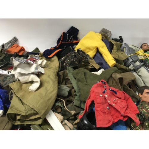 253 - A large collection of Vintage Action Man figure parts and accessories including clothing and weapons... 