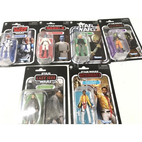 259 - A collection of Star Wars figures all in original unopened packaging.