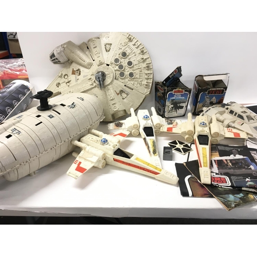 261 - A collection of Vintage Star Wars ships and mini rigs. Also includes leaflet and comic.