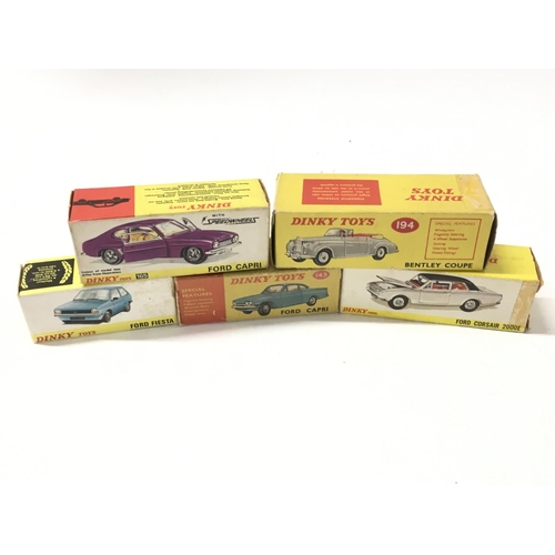 27 - A collection of of 5 boxed diecast model cars by Dinky includes No. 143 a Ford Capri.. No.165 a Ford... 