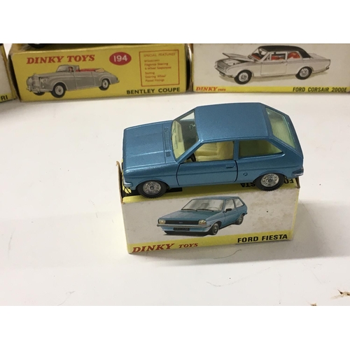 27 - A collection of of 5 boxed diecast model cars by Dinky includes No. 143 a Ford Capri.. No.165 a Ford... 