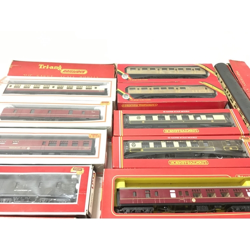 313 - A collection of 17 boxed and 1 loose Coaches and cars 00 gauge. Manufacturers include Hornby..Lima. ... 