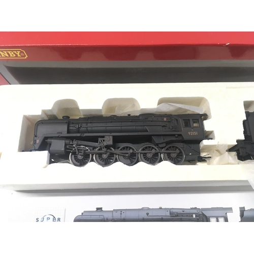 318 - 2x boxed 00 gauge model locomotives by Hornby including R.2200. BR 2.10.0. Class 9 F loco weathered ... 