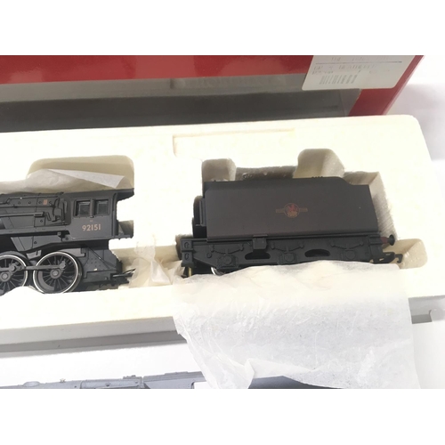 318 - 2x boxed 00 gauge model locomotives by Hornby including R.2200. BR 2.10.0. Class 9 F loco weathered ... 