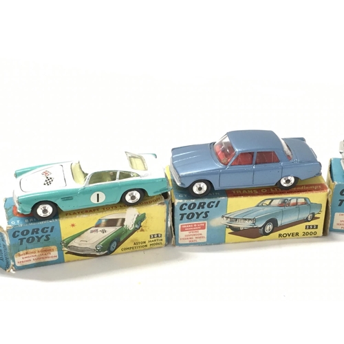 32 - A collection of 4 boxed diecast model cars by Corgi includes No252 a Rover 2000..No309 a Aston Marti... 