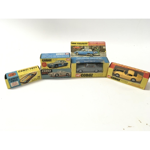 33 - A collection of 5 boxed diecast model cars by Corgi includes No275 a Rover 2000TC..No303 a Mercedes ... 