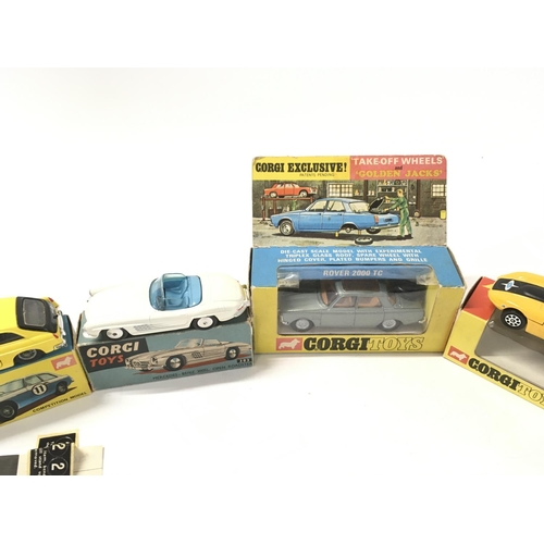 33 - A collection of 5 boxed diecast model cars by Corgi includes No275 a Rover 2000TC..No303 a Mercedes ... 