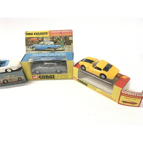 33 - A collection of 5 boxed diecast model cars by Corgi includes No275 a Rover 2000TC..No303 a Mercedes ... 