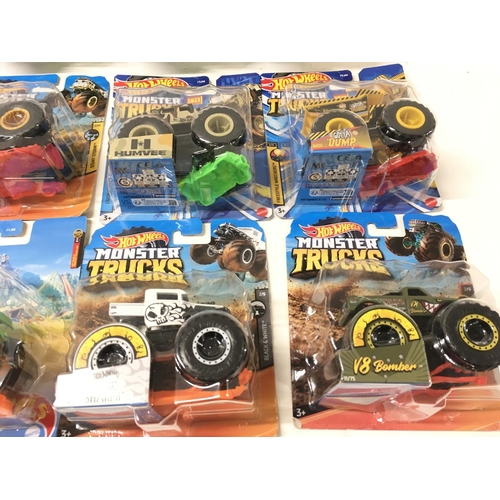 347 - A collection of 12 unopened Hot Wheels Monster Trucks 1:64 scale. Includes Bone Shaker ..Milk Monste... 