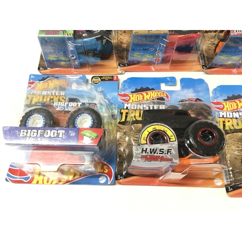 348 - A collection of 12 Hot Wheels Monster Trucks 1:64 scale. Includes All Fried Up..Zombie Wrex..plus ot... 